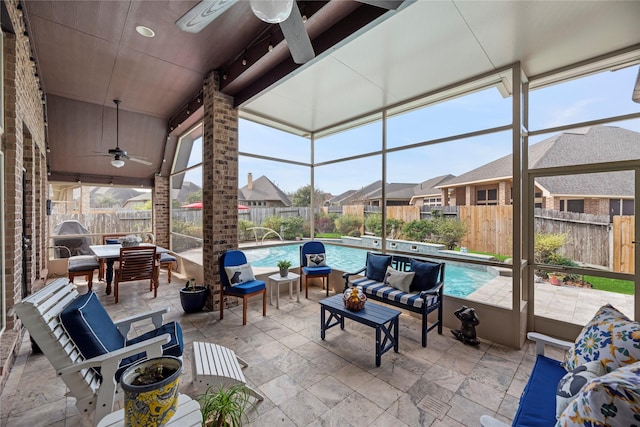 view of patio / terrace with an outdoor living space, a fenced in pool, a lanai, a fenced backyard, and a ceiling fan