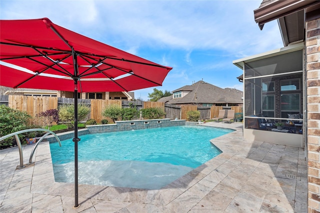 view of swimming pool featuring a fenced in pool, a patio, a fenced backyard, and a sunroom