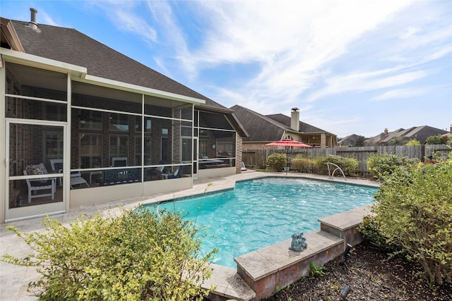 view of pool featuring a fenced backyard, a fenced in pool, and a sunroom