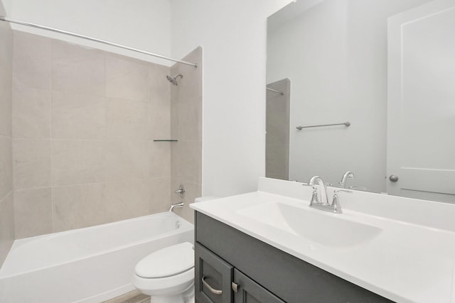 bathroom featuring vanity, toilet, and shower / bathtub combination