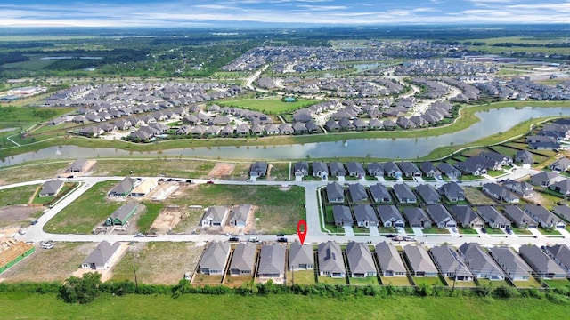 aerial view with a residential view and a water view