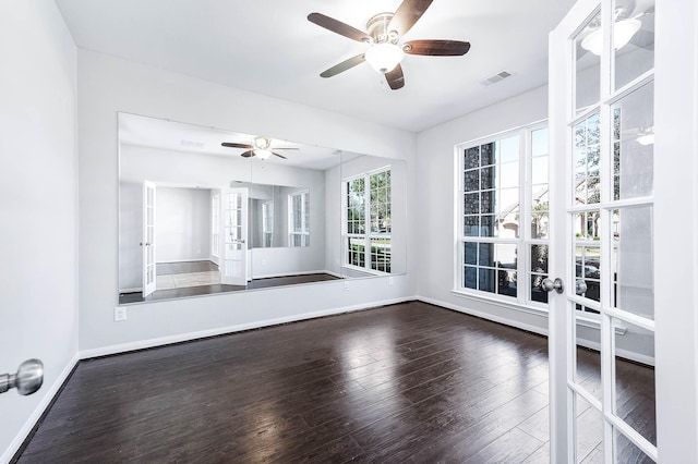 unfurnished room featuring visible vents, dark wood-type flooring, french doors, baseboards, and ceiling fan