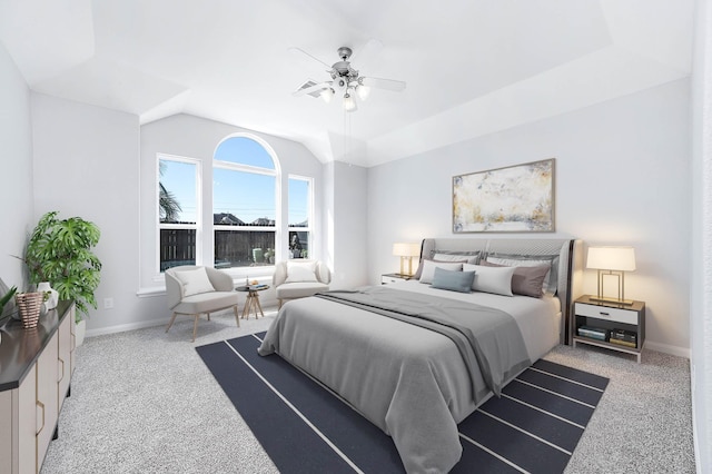 bedroom featuring baseboards, lofted ceiling, and carpet