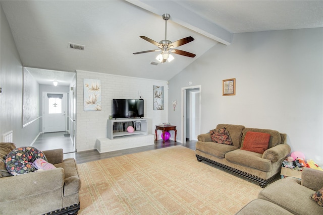 living room featuring lofted ceiling with beams, wood finished floors, visible vents, and ceiling fan