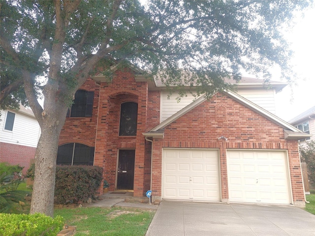 traditional-style home with brick siding and driveway