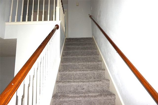 stairway with carpet flooring