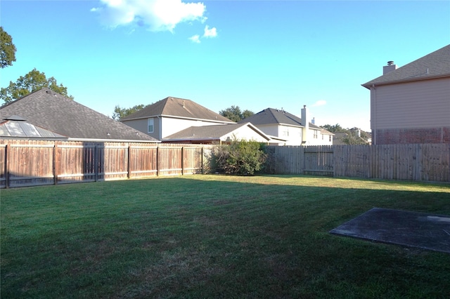 view of yard featuring a fenced backyard