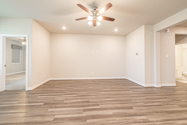 spare room featuring light wood finished floors, recessed lighting, baseboards, and ceiling fan