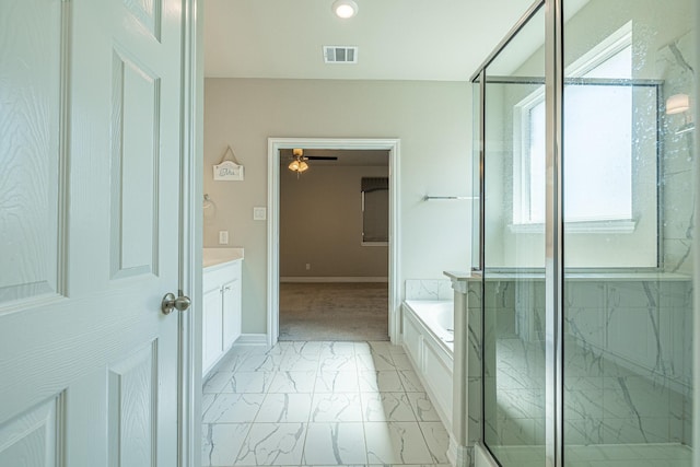 bathroom with visible vents, a shower stall, a garden tub, marble finish floor, and vanity