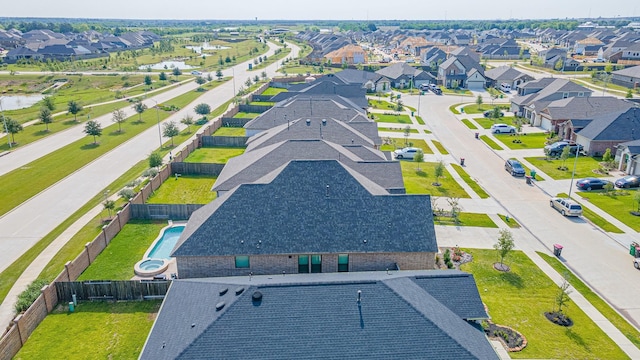 birds eye view of property with a residential view