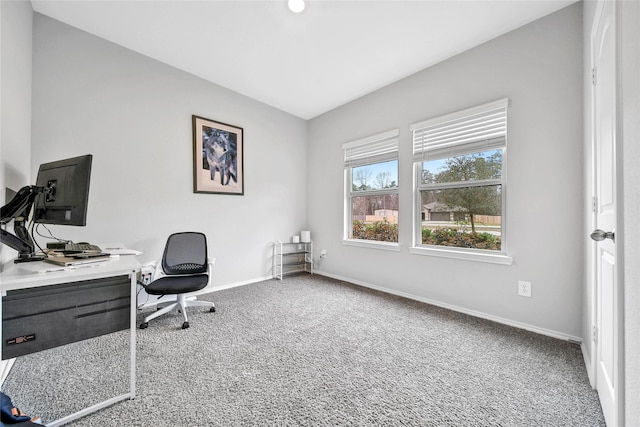 carpeted office featuring baseboards