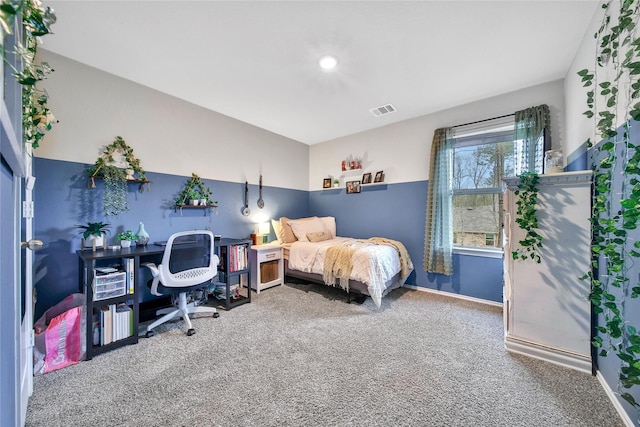 bedroom with carpet, visible vents, and baseboards