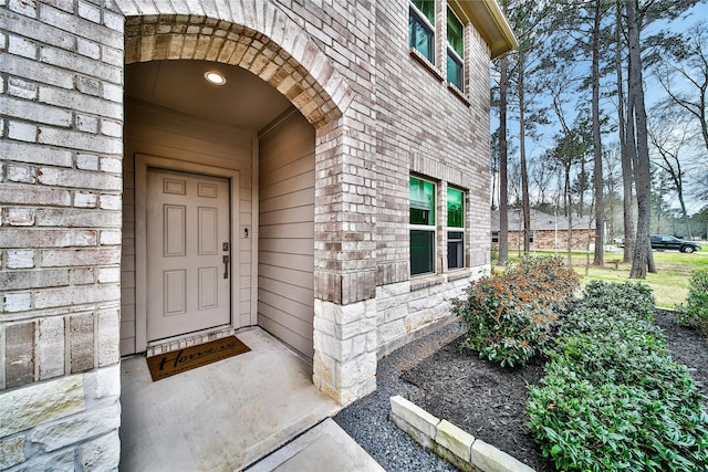 entrance to property with brick siding