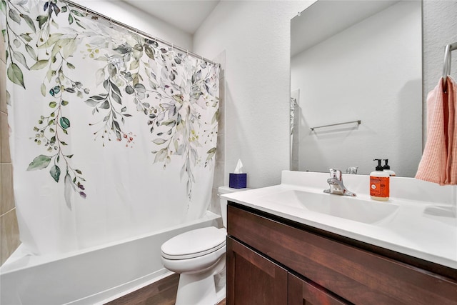 full bath with shower / tub combo, toilet, wood finished floors, and vanity