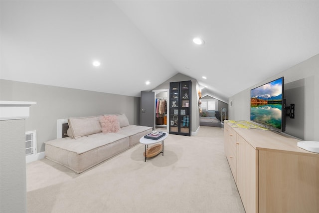 living area featuring baseboards, visible vents, recessed lighting, vaulted ceiling, and light carpet