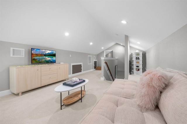 living room with visible vents, light carpet, and lofted ceiling