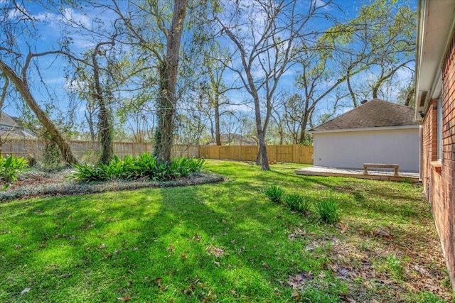 view of yard featuring a deck and a fenced backyard