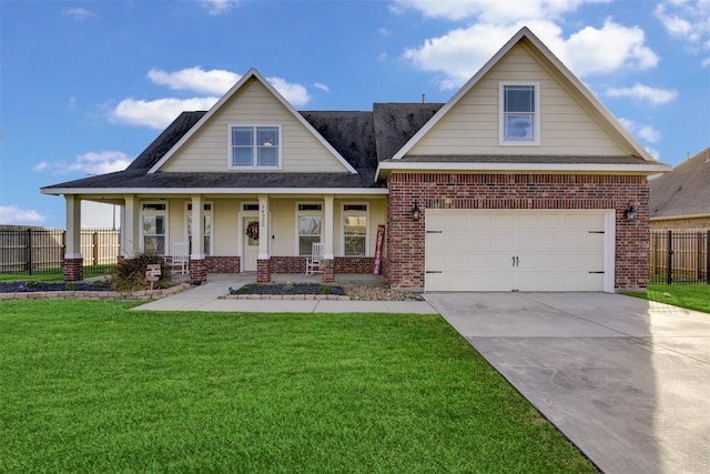 view of front of property featuring fence, a porch, concrete driveway, a front lawn, and brick siding