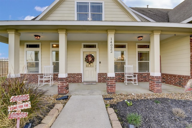 view of front of house featuring a porch and a shingled roof