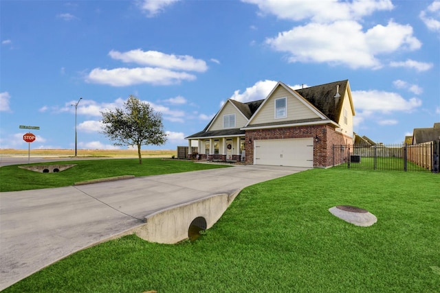 view of front facade featuring brick siding, fence, concrete driveway, a front yard, and an attached garage