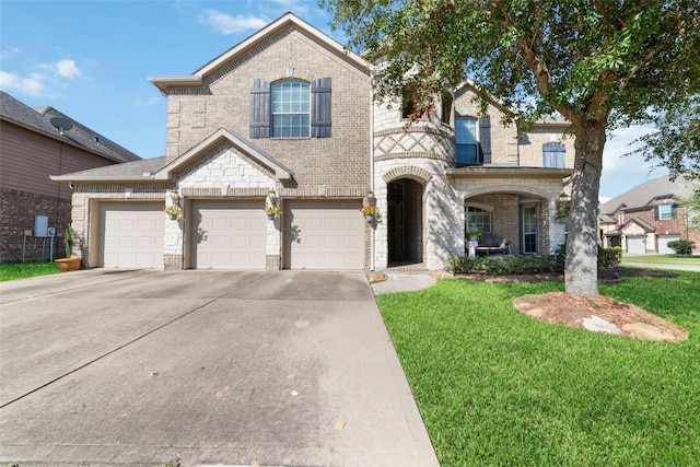 view of front of property featuring brick siding, a garage, concrete driveway, and a front lawn