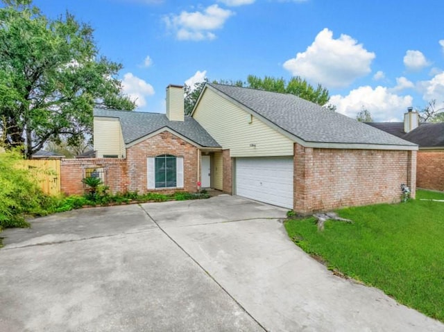 ranch-style home featuring a front yard, an attached garage, brick siding, and a chimney