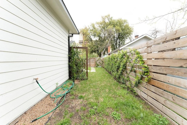 view of yard with a fenced backyard