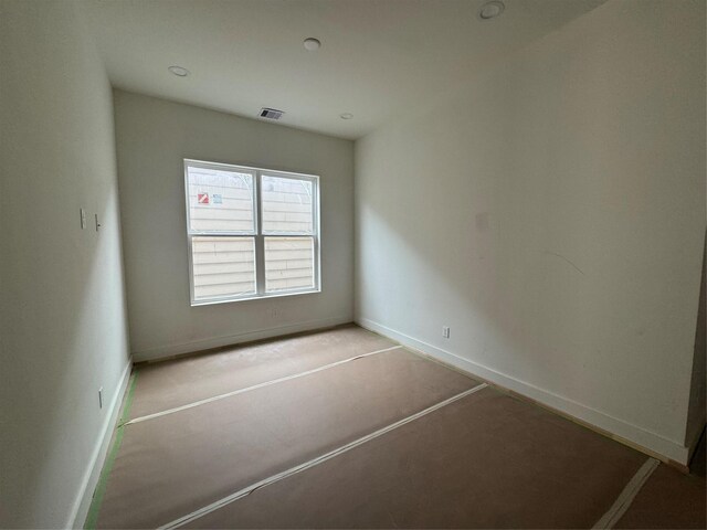 4403 Feagan, Houston, TX 77007 - unfurnished room featuring baseboards and recessed lighting