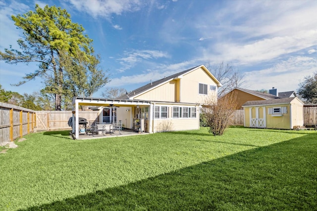 rear view of property with a patio, a shed, a fenced backyard, an outdoor structure, and a lawn