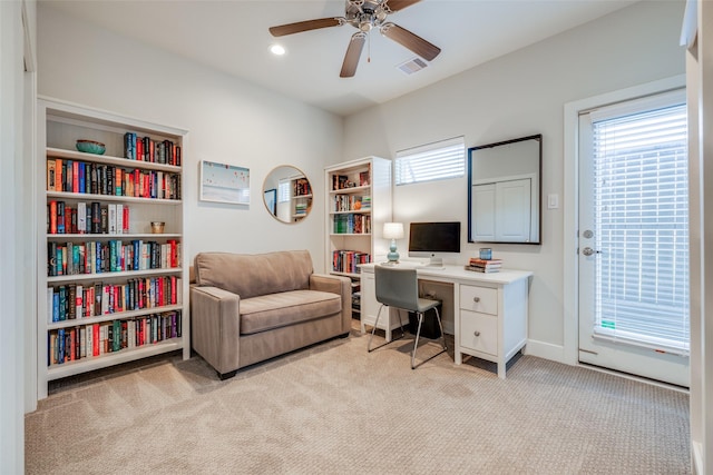 office space featuring a ceiling fan, visible vents, baseboards, recessed lighting, and light colored carpet