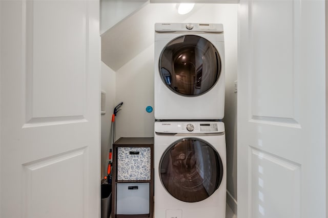 washroom featuring laundry area and stacked washer and clothes dryer