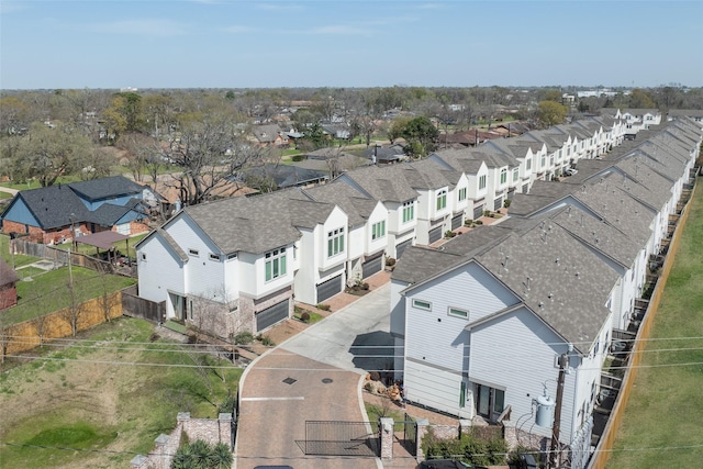 birds eye view of property with a residential view