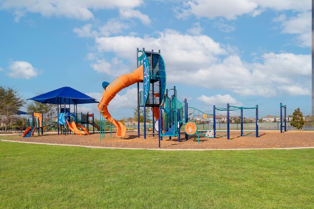 communal playground featuring a yard