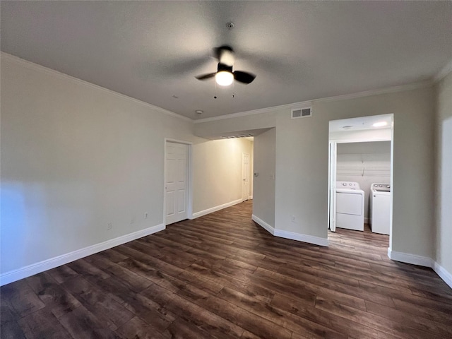 interior space featuring baseboards, visible vents, dark wood-style flooring, ceiling fan, and washer and clothes dryer