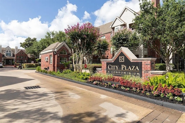 community / neighborhood sign featuring a residential view