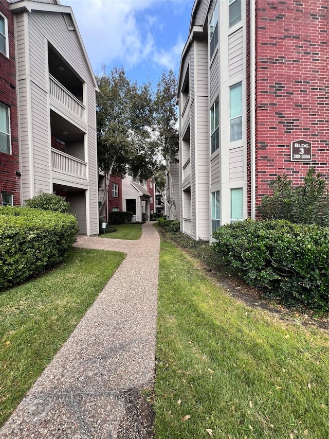 view of property's community with a yard