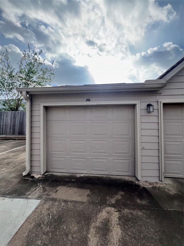 garage with fence