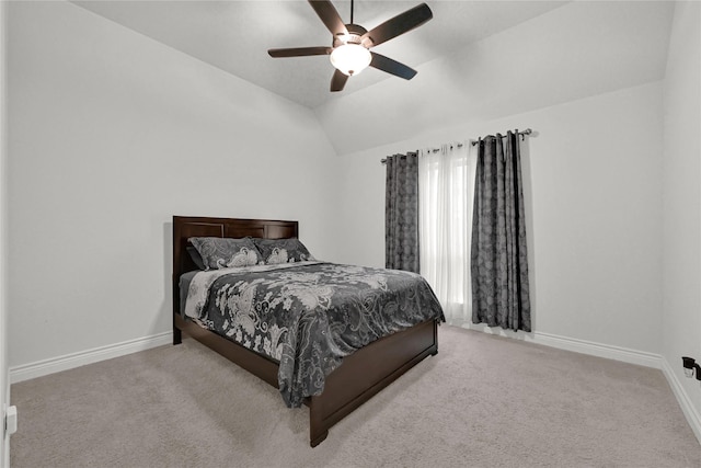 bedroom with baseboards, carpet, ceiling fan, and vaulted ceiling