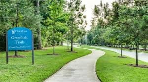 view of home's community with a yard