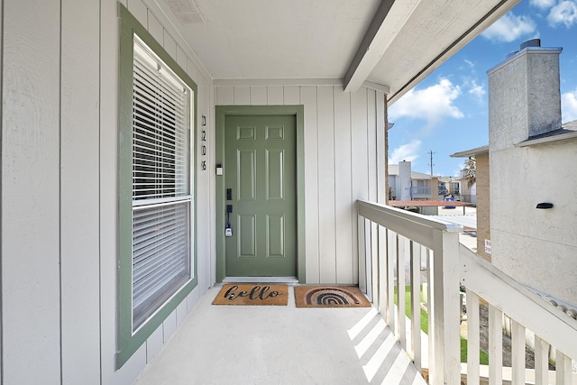 property entrance featuring visible vents and a balcony