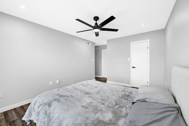 bedroom with visible vents, baseboards, recessed lighting, dark wood-style flooring, and ceiling fan