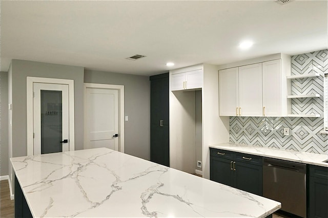 kitchen featuring visible vents, backsplash, dishwasher, light stone counters, and white cabinetry