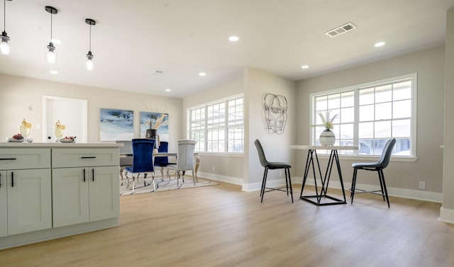 dining space with recessed lighting, visible vents, baseboards, and light wood-style flooring