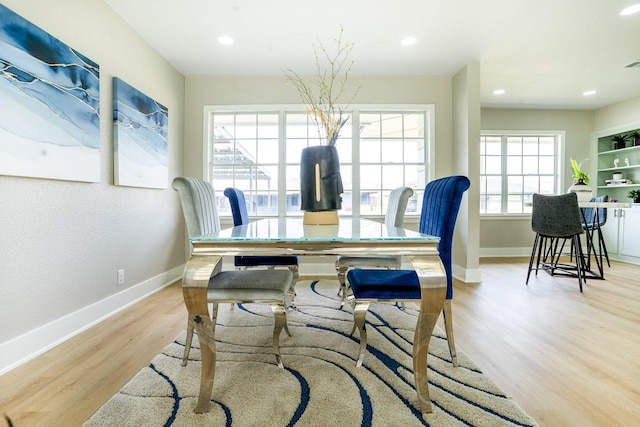 dining room featuring visible vents, light wood-style flooring, recessed lighting, and baseboards