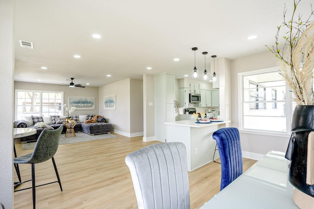 interior space featuring recessed lighting, baseboards, and light wood-style flooring