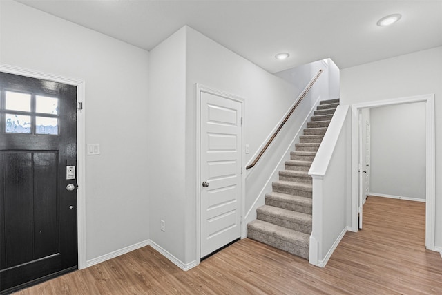 10718 Soapberry Ct, Tomball, TX 77375 - foyer with stairway, baseboards, recessed lighting, and light wood finished floors
