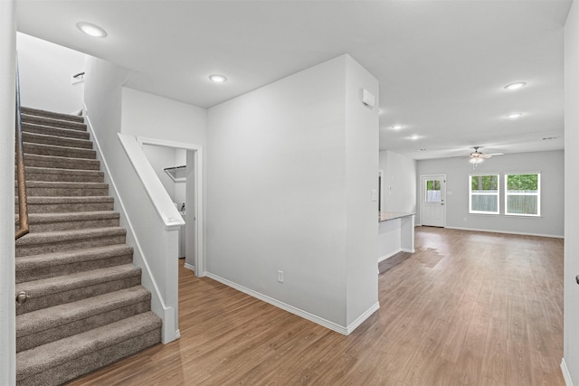 10718 Soapberry Ct, Tomball, TX 77375 - stairway with baseboards, ceiling fan, recessed lighting, and wood finished floors