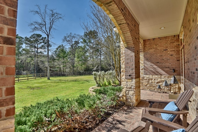 view of yard featuring a patio and fence