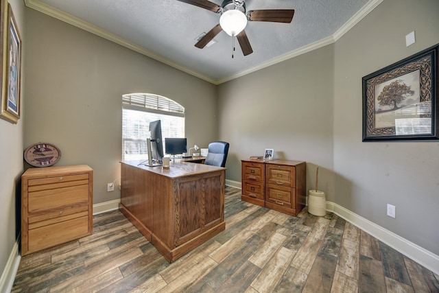 home office featuring baseboards, ornamental molding, wood finished floors, a textured ceiling, and a ceiling fan