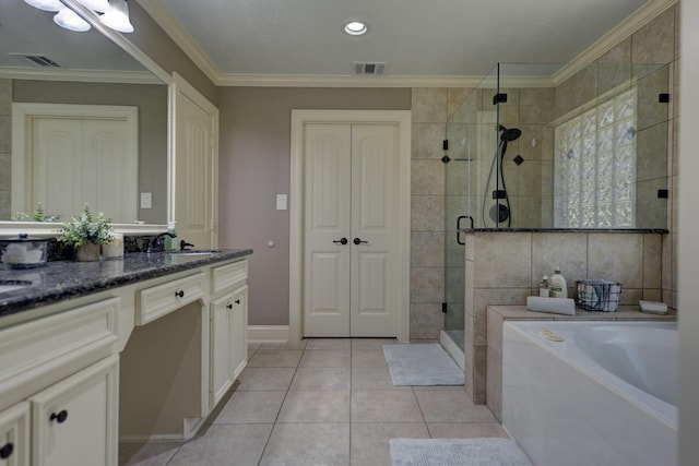 bathroom with vanity, visible vents, a stall shower, tile patterned flooring, and crown molding